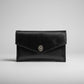 hanadmade Black leather clutch with a turn lock closure and hair-on cowhide in black