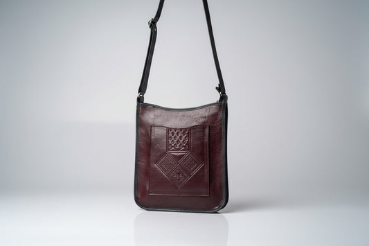 Handmade burgundy leather bag with geometric design