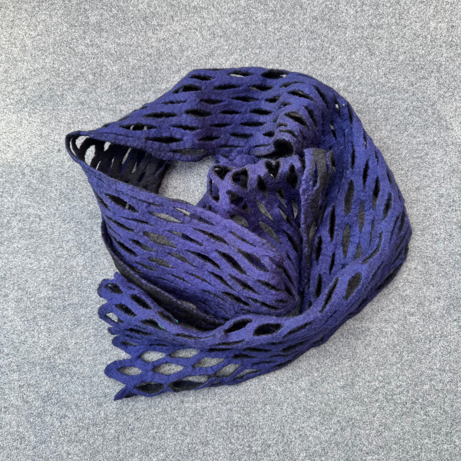 Blue lace scarf on a gray background
