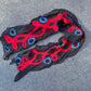 Black scarf with red and blue patterns on a gray surface