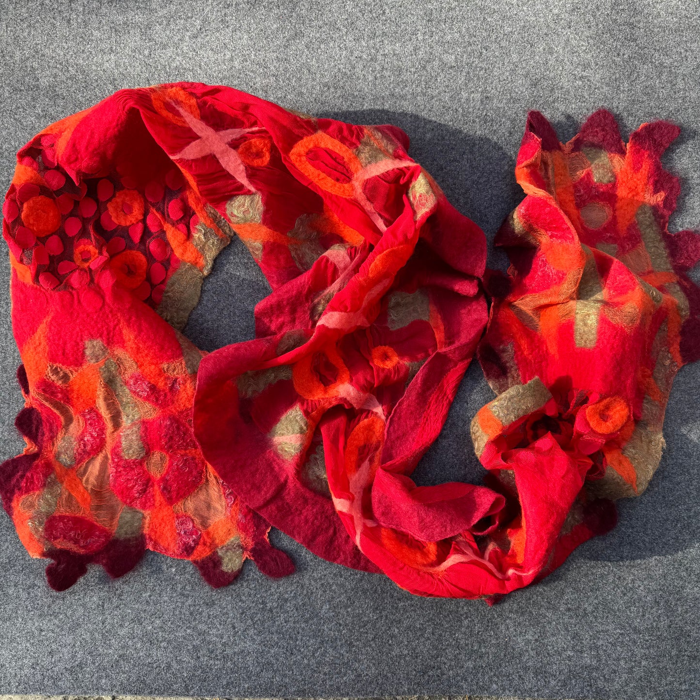 Red and orange textured scarf, handmade in Nuno technique