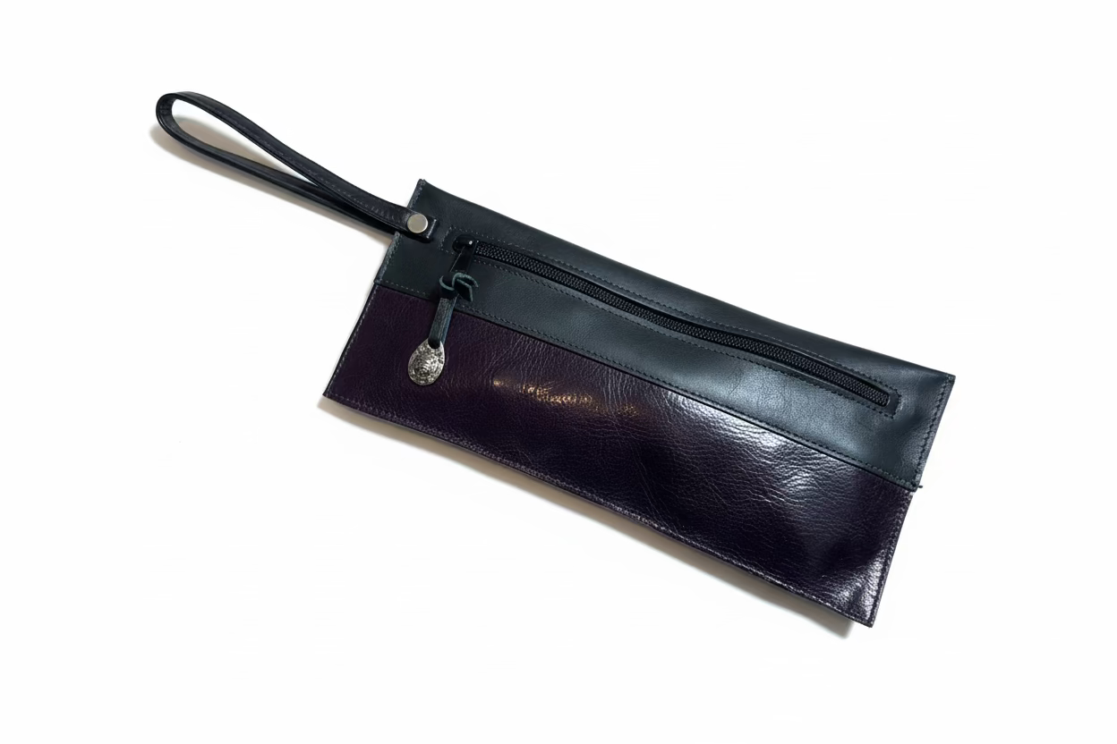 Handmade Black leather pouch with a zipper and eggplant color accents