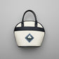 White handbag with black handle and trillium embossed design and handpainted on on leather